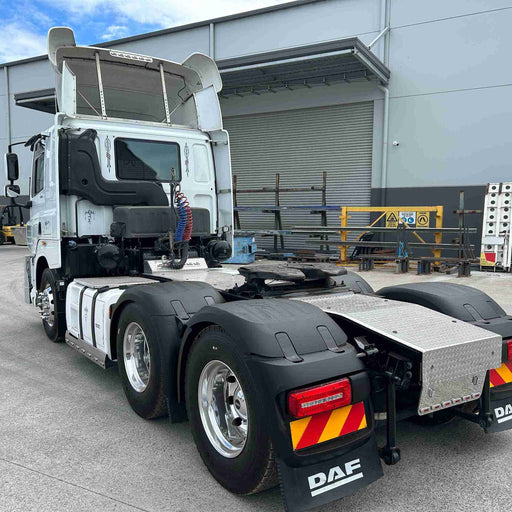DAF truck parked in front of a warehouse